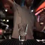 clear drinking glass with silver spoon